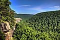 Hiker on the famous Hawksbill Crag in Arkansas.