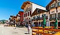 Shops and sidewalk cafes line the quaint Bavarian themed main street of the tourist resort town of Leavenworth. Editorial credit: Kirk Fisher / Shutterstock.com