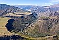 Drone view of Debed river gorge, Alaverdi town and Sanahin village on sunny summer day. Lori Province, Armenia. Image credit Kirill Skorobogatko via Shutterstock.