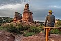 Man in the foreground of Lighthouse Trail at Palo Duro Canyon State Park, Texas. 