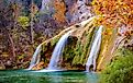 Color photograph of Turner Falls waterfall near Davis, Oklahoma during fall. 