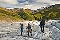 People hiking in Wrangell-St. Elias National Park and Preserve, Alaska.