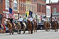 Horses and riders in the Washunga Days Parade in Council Grove, Kansas. Image credit mark reinstein via Shutterstock