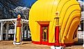 A vintage Shell gas station is shaped like a yellow scallop shell. Editorial credit: James Kirkikis / Shutterstock.com