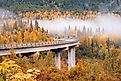 A highway along Canyon Creek Rest Area, Seward, Alaska during autumn.