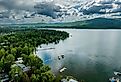 Aerial view of Whitefish Lake in Montana with docks and homes along the water's edge.