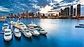 Miami, Florida marina and skyline at dusk on a cloudy evening.