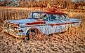 Abandoned classic car in Warsaw, Missouri. Editorial credit: Charles Pittaluga / Shutterstock.com