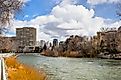 Reno, Nevada, skyline as seen from the shoreline of Truckee River flowing through downtown. 