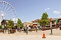 Pigeon Forge, Tennessee. Located in the Appalachian Mountains, Pigeon Forge is a tourist destination for many. Full of shops, a ferris wheel, good food, and various shops