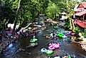 Tourists tubing the lazy river Chattahoochee in the summer in Helen, Georgia. Image credit Paul Hakimata Photography via Shutterstock