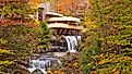 Fallingwater, the iconic house designed by Frank Lloyd Wright, perched over Bear Run waterfall in Mill Run, Pennsylvania. Editorial credit: Sean Pavone / Shutterstock.com