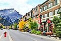 Street view of famous Banff Avenue in Banff, Alberta. Editorial credit: i viewfinder / Shutterstock.com.