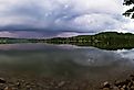 Panorama view of Lemon Lake with trees and homes on the far side.