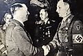 Adolf Hitler shakes hands with Victor Lutz, Chief of Staff of the SA after murder of Ernst Rohm. Image credit IgorGolovniov via Shutterstock