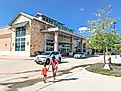 Family members entering Whole Foods in Highland Village, Texas, a suburb of Dallas, known for selling high-quality and natural produce. Editorial credit: Trong Nguyen / Shutterstock.com