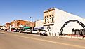 The Perry Wrestling Monument Park and the old business district on Delaware Street. Perry, Oklahoma. Editorial credit: Roberto Galan / Shutterstock.com