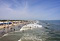 People enjoying a day at the beach on the Atlantic Ocean in Tybee Island, Georgia. Editorial credit: Ruth Peterkin / Shutterstock.com