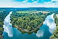 An aerial view panorama of the Kentucky river with a boat on the water. Image credit Cade Nathaniel Nicholson via Shutterstock.