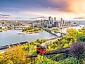 Downtown skyline of Pittsburgh, Pennsylvania at sunset. Image credit f11photo via shutterstock