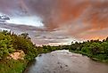 Colorful sunrise clouds over the Niobrara River near Valentine, Nebraska, USA.