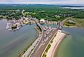 Niantic Beach Railroad Bridge aerial view which connects Route 156 on a cloudy day between Niantic River and Niantic Bay in village of Niantic, East Lyme, Connecticut.