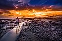 Hiker with a backpack on a trail at Craters of the Moon National Monument in Idaho