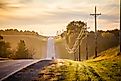 A quiet country road, surrounded by expansive fields in Midwest Nebraska.