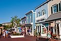 Tourists walk through Washington Street Mall, lined with boutiques, eateries and shops in Cape May, New Jersey. Image credit JWCohen via Shutterstock