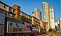 An Amtrak Texas Eagle train stops in the Austin Texas depot with the skyline in the background. Editorial credit: Ian Mason / Shutterstock.com