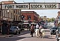 Horseback riding through the Fort Worth Stockyards in Texas. Image credit 4kclips via Shutterstock