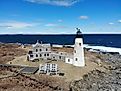 Aerial drone views of Wood Island Lighthouse on Wood Island in Biddeford, Maine. 