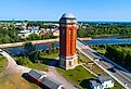 The Old Manistique Water Tower with the town in the background. Image credit Dennis MacDonald via Shutterstock