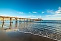 Malibu pier under a blue sky at sunset. California, USA