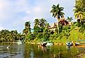 Resort on the Rio Dulce, the most famous and important river of Guatemala, Central America. Here, south of Livingston, it flows into the Gulf of Honduras in the Caribbean sea. Image credit Judith Lienert via Shutterstock.