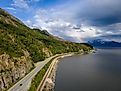 Aerial view of Turnagain Highway near Anchorage, Alaska, overlooking Turnagain Arm Bay.