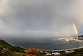 A magnificent double rainbow over the village of Simon's Town, on False Bay, South Africa. Image credit Cathy Withers-Clarke via Shutterstock. 