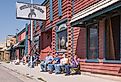 Group of people watching the solar eclipse in front of the Outlaw Saloon, Dubois, Wyoming. Image credit Sandra Foyt via Shutterstock