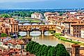 Panoramic view of medieval stone bridge Ponte Vecchio over the Arno River.