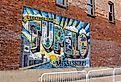 Tupelo, MS mural in downtown Tupelo, MS. Image credit Chad Robertson Media via Shutterstock.