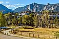 Downtown Estes Park, with The Stanley Hotel and Rocky Mountains in the background.