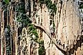 Visitors walking along the World's most dangerous footpath. Editorial credit: Dziewul / Shutterstock.com