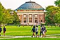 College students walk on the quad lawn of the University of Illinois campus in Urbana, Illinois.