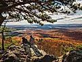 Two people enjoying the view from the Sugarloaf Mountain of Maryland.