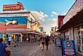 View of the Ocean City boardwalk in Ocean City, Maryland. Image credit Yeilyn Channell via Shutterstock.