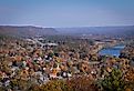 Aerial view of Milford, Pennsylvania, and the Delaware River from a scenic overlook on a sunny fall day.