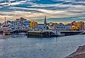 Pickering Wharf Marina Cityscape, water, boats, trees, fall colors, Salem, Massachusetts. Image credit Terry Kelly via Shutterstock