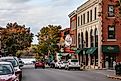 Bar Harbor downtown during Autumn season, Main Street view with gift shops and other buildings.