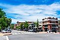 Cars parked in Downtown Paso Robles along 12th street with historic Clock Tower Acorn Building in background, via Michael Vi / Shutterstock.com