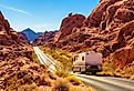 Motorhome trailer traveling on the road in Valley of Fire in Nevada. Image credit Nick Fox via Shutterstock.